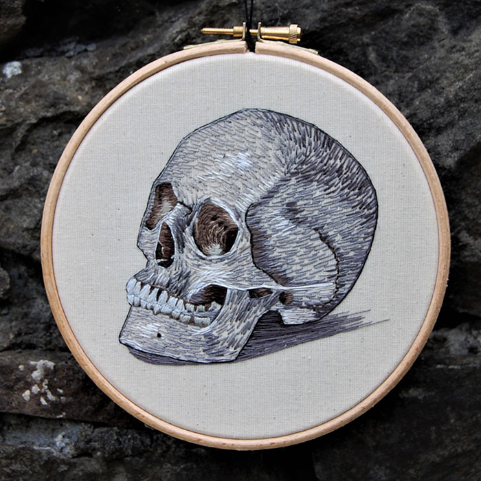 Embroidered hoop of the human skull by Cath Janes