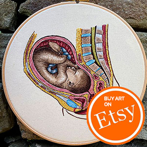 Anatomically embroidered (foetus) baby in utero embroidery art by Cath Janes