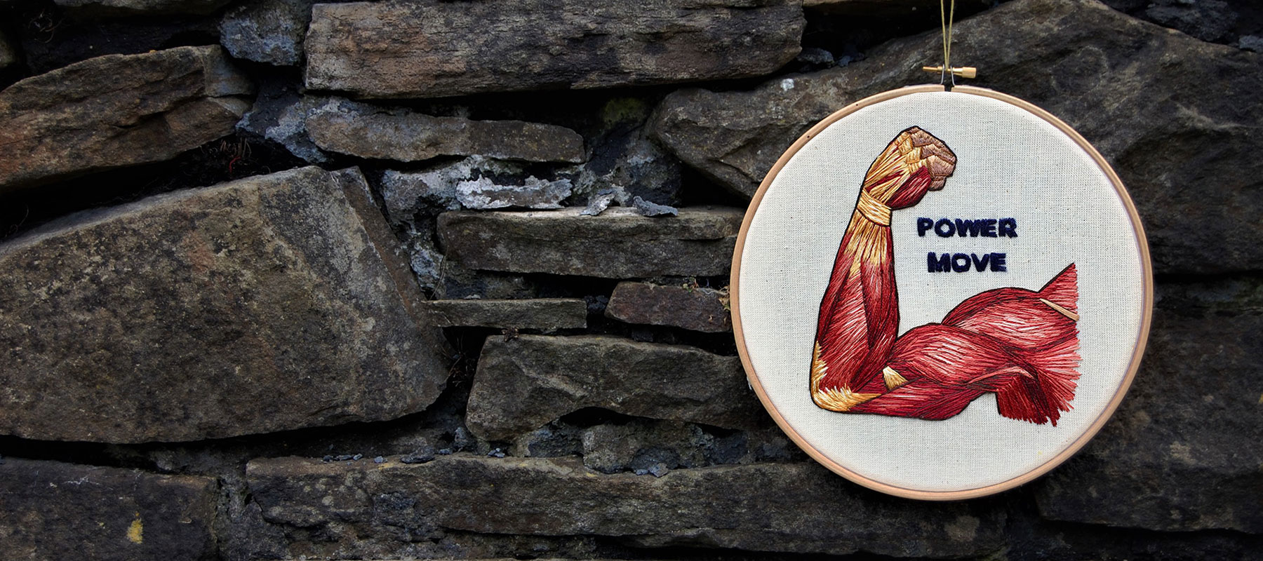 Bicep Curl by medical anatomy illustrator Cath Janes using embroidery as a medium